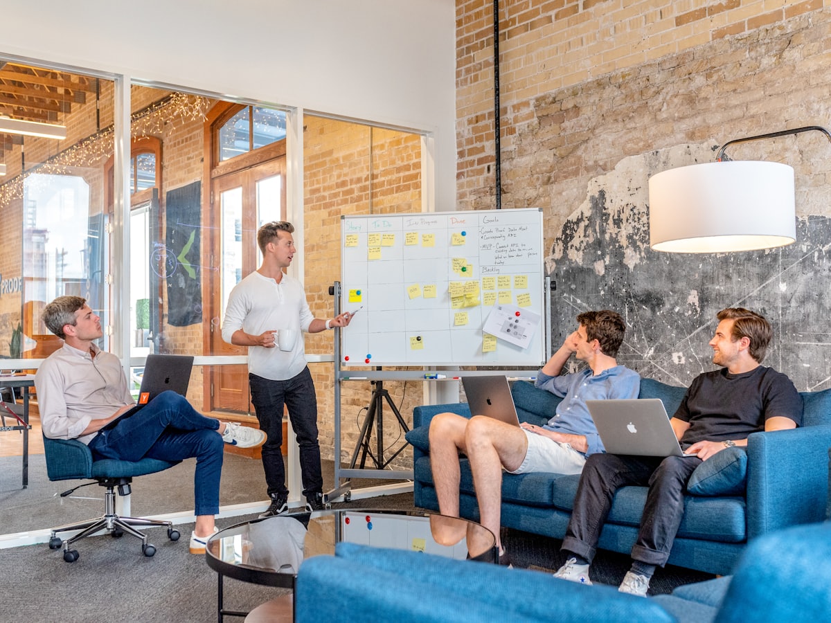 A team planning a marketing strategy at a whiteboard